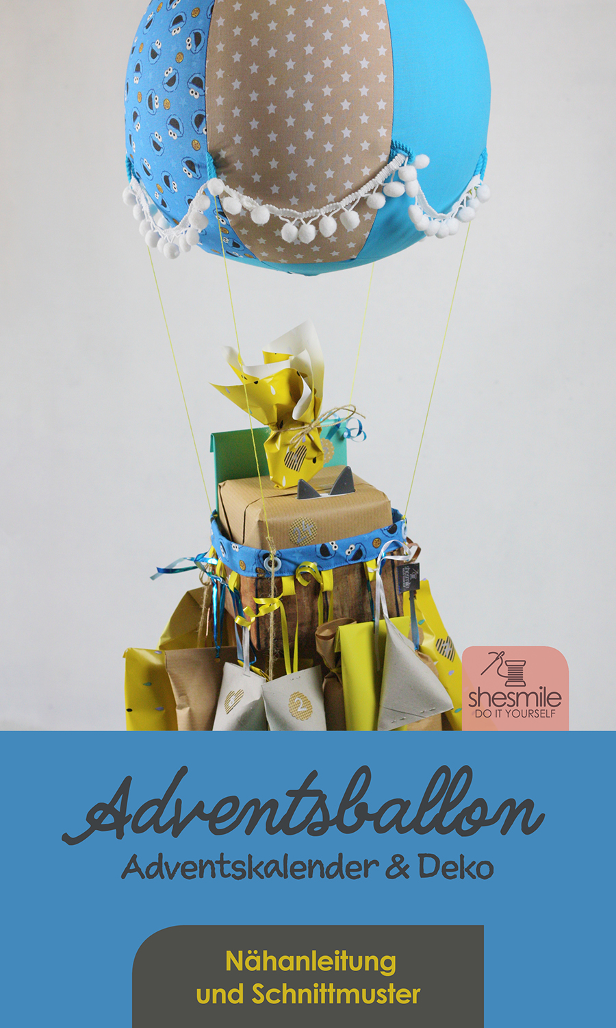Ein Adventskalender Adventsballon mit Krümelmonster in blau-gelb für mein Patenkind. Nähanleitung und Schnittmuster gestaltet als PDF-E-Book von shesmile für einen Adventskalender und Kinderzimmerdeko Adventsballon in Form eines Heißluftballons. 24 kleine Geschenke oder ein Musikwürfel finden ihren Platz an den Halteschlaufen am oder im Körbchen.