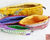 Taschen und Reißverschluss-Täschchen aus alten Verpackungen von Milka, Süßigkeiten, Maiswaffeln, Schokolade und Chipstüten nähen. Eine kostenlose Nähanleitung mit Tipps und Tricks mit Buchfolie von Melie von GrünBlauMeliert und Lisse von shesmile.