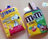 Taschen und Reißverschluss-Täschchen aus alten Verpackungen von Milka, Süßigkeiten, Maiswaffeln, Schokolade und Chipstüten nähen. Eine kostenlose Nähanleitung mit Tipps und Tricks mit Buchfolie von Melie von GrünBlauMeliert und Lisse von shesmile.