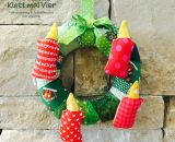 Adventskranz aus Stoff Klett mal Vier (Eine DIY-Nähanleitung mit Schnittmuster von shesmile) Ein Adventskranz ohne Feuer zum Spielen. Ideal für Kindergarten, Mama-Kind-Gruppen oder das Kinderzimmer. Außerdem eine wunderschöne Weihnachtsdeko.