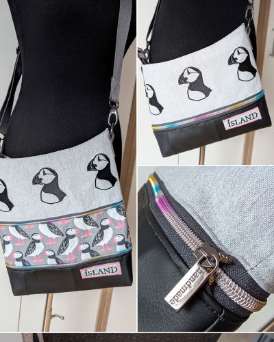 Mein 2. Versuch für die Handtasche Zipkram von shesmile. Ich habe ein besticktes Baumwoll-Geschirrtuch (Souvenir aus Island) verwendet mit gestickten Puffins. Den Schriftzug vom Tuch habe ich als Patch verwendet. Das Unterteil ist aus Kunstleder und das Futter sowie Zwischenstück sind leichter Baumwollstoff, den ich mal auf einer Messe ergattert habe. Ich wusste für die Einzelteile noch nicht, was ich daraus mache. Das Schnittmuster hat mich dann auf die Idee gebracht. Die Tasche ist für mich und dient als persönliche Erinnerung an einen tollen Urlaub. Das was man vor Ort kaufen kann, ist ja meist billiger Kitsch.